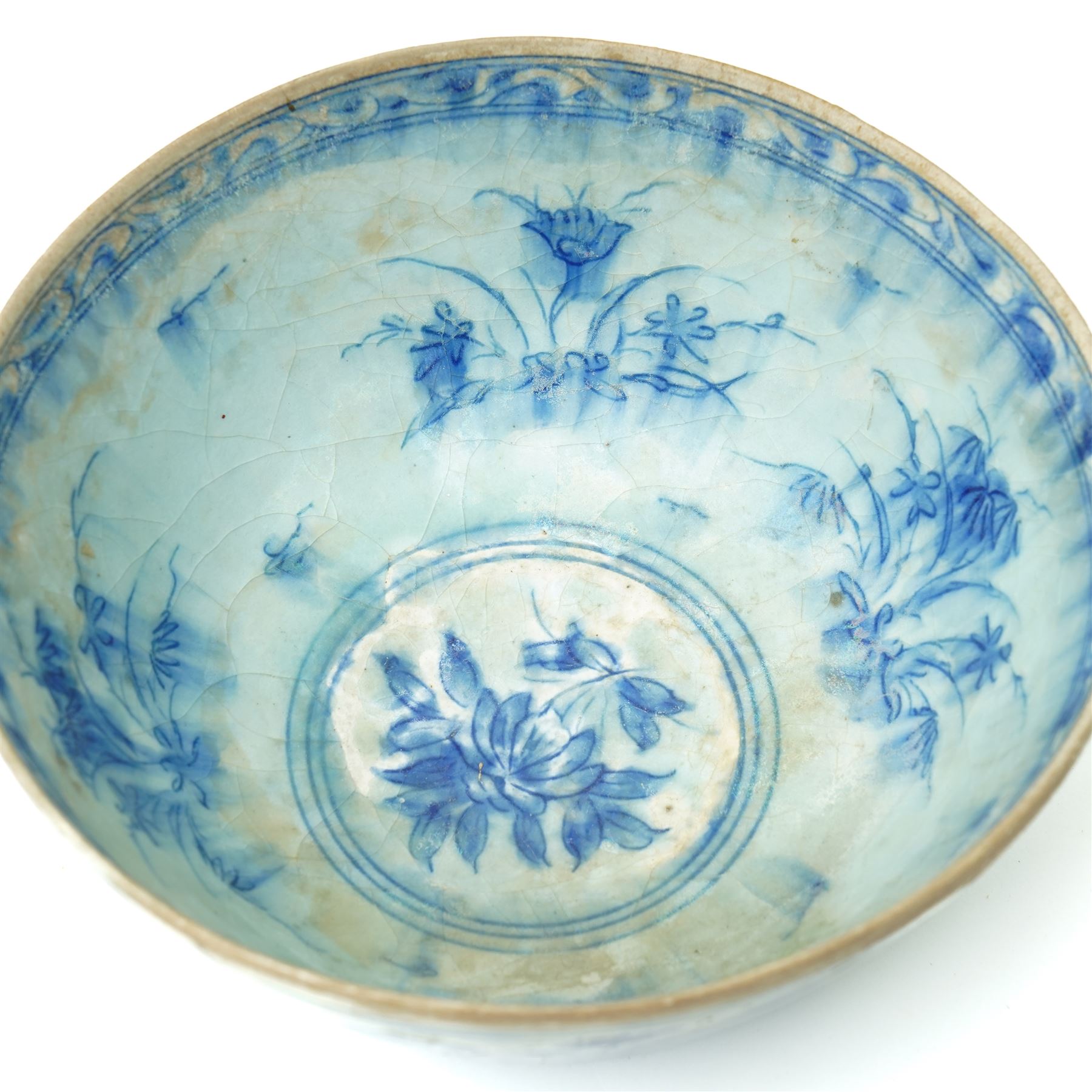 17th century Persian Safavid bowl decorated in the Chinese manner in blue and white with figures and flowers and with pseudo Chinese marks D23cm