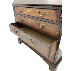Georgian oak bureau, fall front enclosing fitted interior, four long graduating drawers, on bracket feet