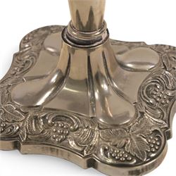 Silver plate two branch candelabra with grape vine decoration to the base, together with a matching pair of candle sticks and other candlesticks  