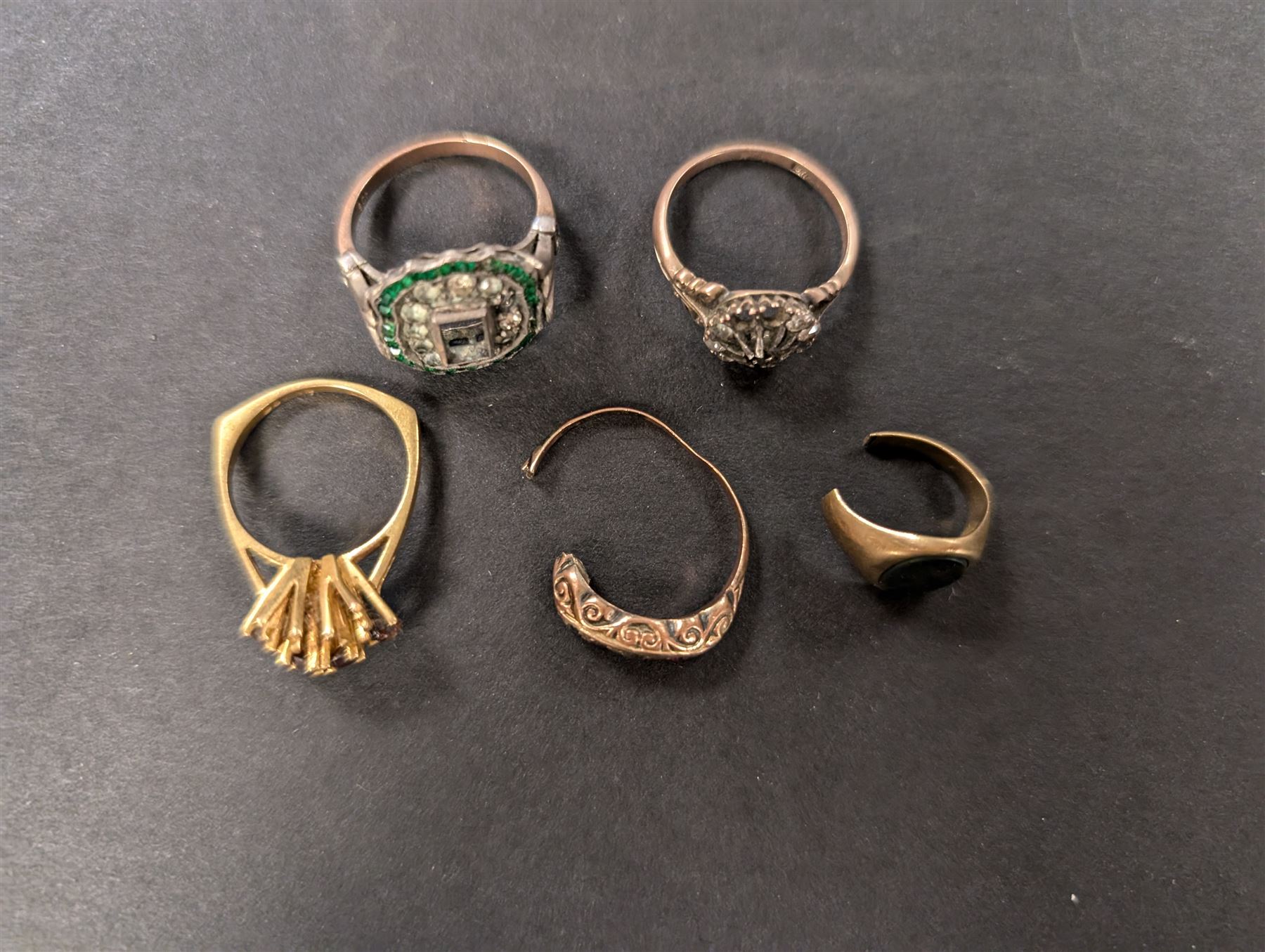 Five 9ct gold rings, all stone set and with split/bent/missing bands