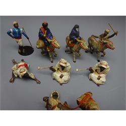  Eight die-cast Middle Eastern figures including camel rider, three donkey riders etc  