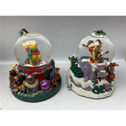 Six Disney Winnie the Pooh Christmas snow globes, comprising large Mr Christmas Holiday Snowfall, An Enchanted Christmas, It's A Small World Christmas 1994,  Tree Trimming, 1995 Christmas At Our House and Christmas Band Concert, together with Mr Christmas Holiday Go Round, all with boxes (7)