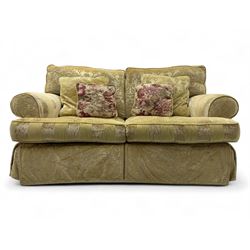 Contemporary two-seat sofa, upholstered in damask fabric with a pale gold floral pattern, rolled arms with covers, loose back and seat cushions, on matching skirted base with concealed castors