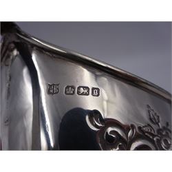 Late Victorian silver milk jug and twin handled open sucrier, each of oval form with angular handles and embossed floral, foliate and C scroll decoration, hallmarked James Deakin & Sons, Sheffield 1899, sucrier with handles H10.8cm