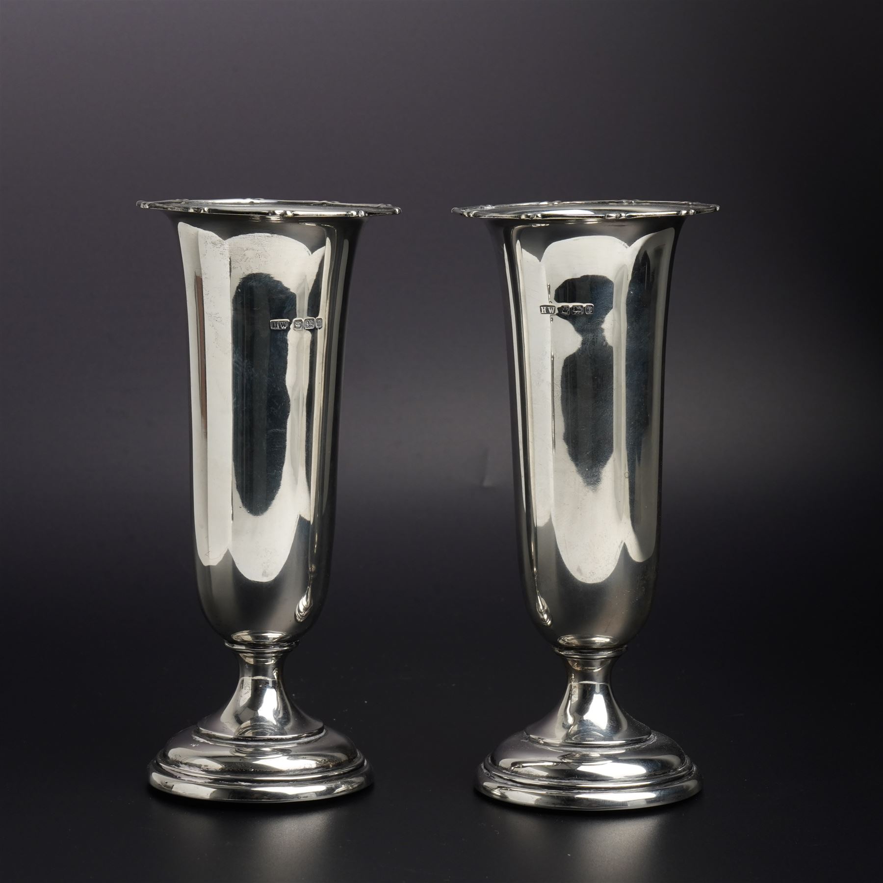 Pair of embossed silver trumpet shape vases H21cms marks rubbed but maker Henry Matthews and another pair of plain vases H15cm Sheffield 1913 Maker Lee & Wigfull