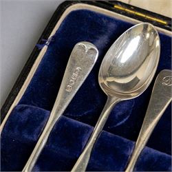 Set of six 1920s silver teaspoons with engraved initials, together with two sets of silver handled tea and fruit knives, all hallmarked and all within fitted cases
