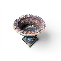 Circle of Coalbrookdale - 19th century cast iron and black painted campana shape urn with flared and scalloped rim, gadrooned underbelly on stepped square base