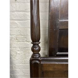 17th century style oak 4' four poster bed, high panelled back with projecting canopy cornice and panelled roof, turned posts with panelled front