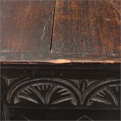 19th century oak cupboard cabinet, the moulded rectangular top above a deeply carved front carved with frieze of lunettes above a central panelled cupboard door with lozenge and foliate carving, flanked by vertical carved panels, upon turned legs with boarded lower shelf