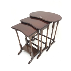 Edwardian mahogany kidney shaped nest of tables, turned supports on shaped sledge feet, W56cm, H60cm, D38cm