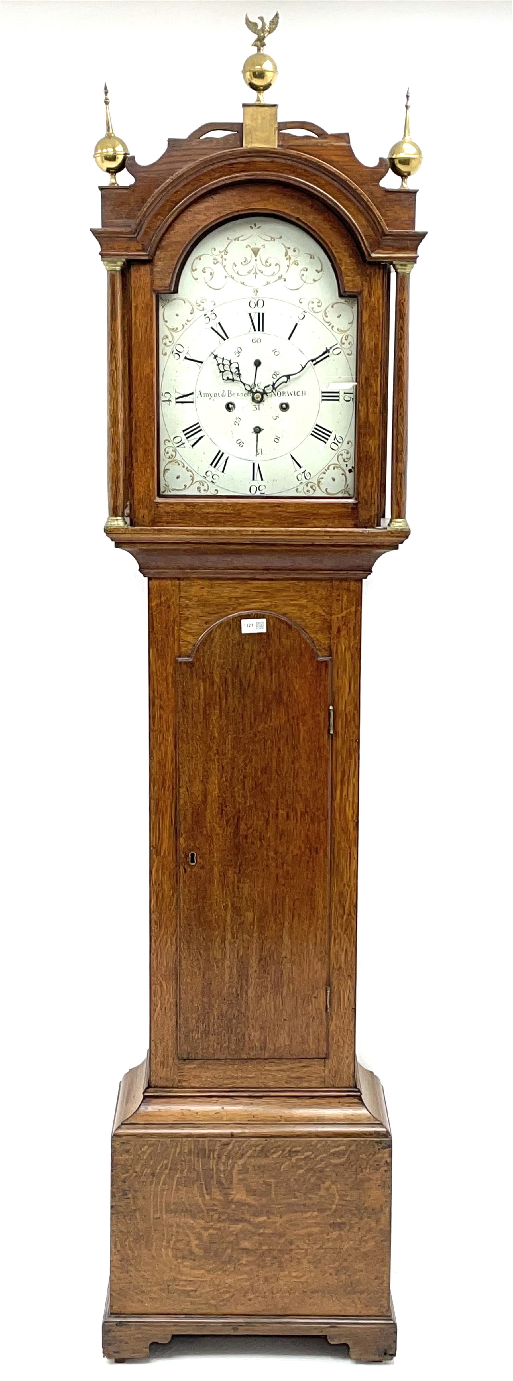 Early 19th century oak longcase clock, the enamel dial decorated with raised gilt trailing scrolls, signed 'Amyot & Bennett, Norwich', 8-day movement striking on bell