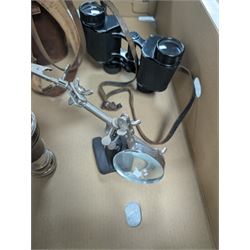 Three pairs of binoculars including Wrayvu 8x30 and Busch Hellux, together with a tabletop magnifying glass