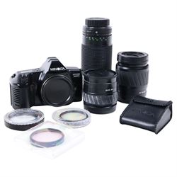 Minolta Dynax 3000i camera body, with three lenses including Sirius MC Auto Zoom 1:3.9 f=8...