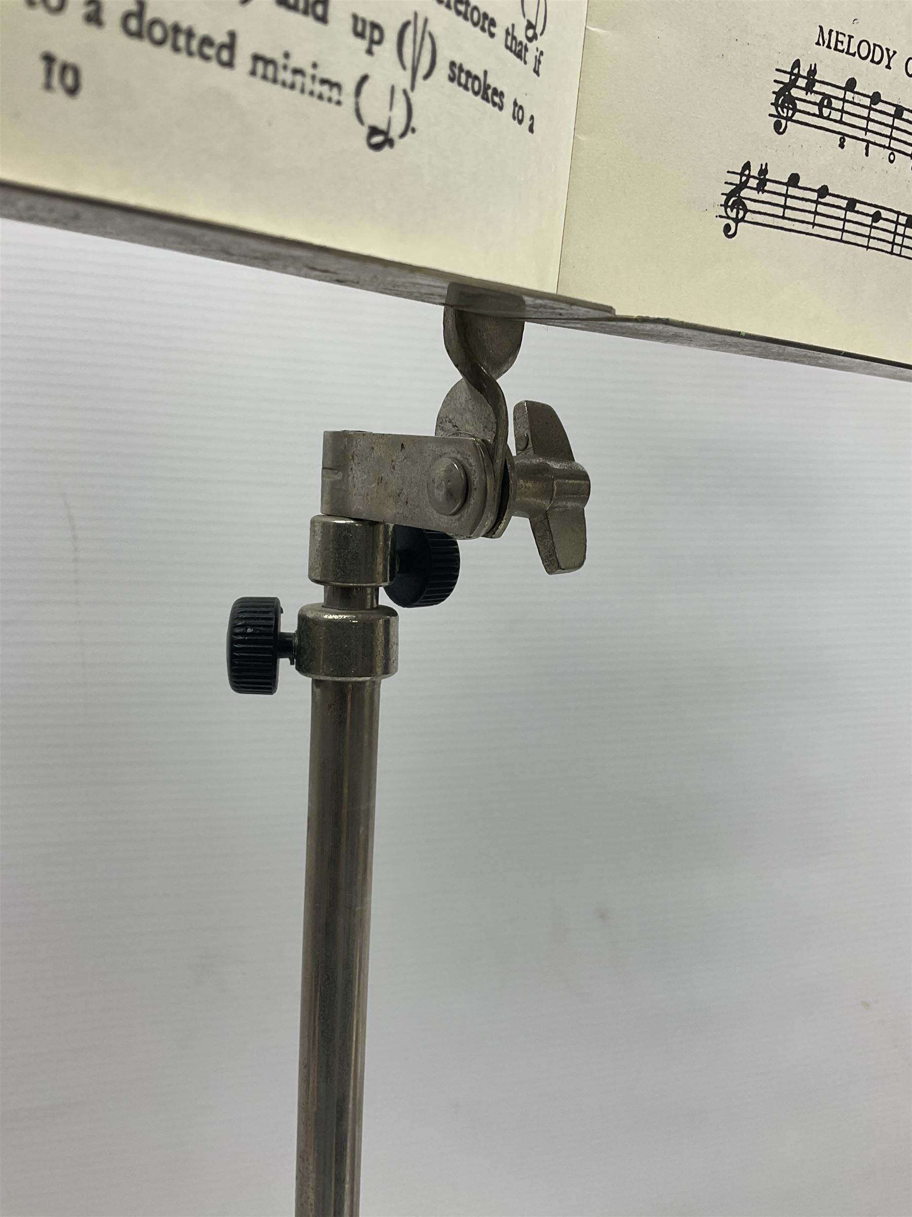 Late 19th/early 20th century Italian lute back mandolin with segmented back and spruce top; bears maker's label for Pietro Tonelli Napoli; together with a mandolin instruction booklet and a folding music stand L60.5cm