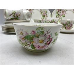 Royal Doulton Apple Blossom pattern tea service for twelve, comprising twelve saucers, twelve tea plates, twelve teacups, milk jug, sucrier and two cake plates