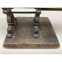 Victorian cuff and collar tabletop mangle, the ribbed brass rollers in a cast iron frame mounted on a wooden base