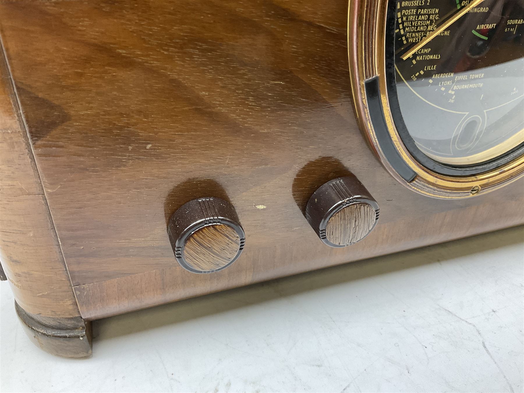 Late 1930s Art Deco Ferguson 503AC walnut cased valve radio, with glazed oval dial above four Bakelite knobs, H55cm D28cm W42cm