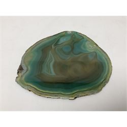 Pair of green agate slices, polished with rough edges, raised upon silvered metal stands, H23cm