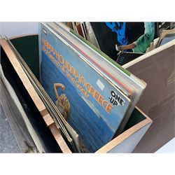Wooden magazine rack, with floral detail, together with a collection of records, to include the box sets 'the Story of Great Music', 'Popmobility', Happy Holiday in Greece  etc, in three boxes 