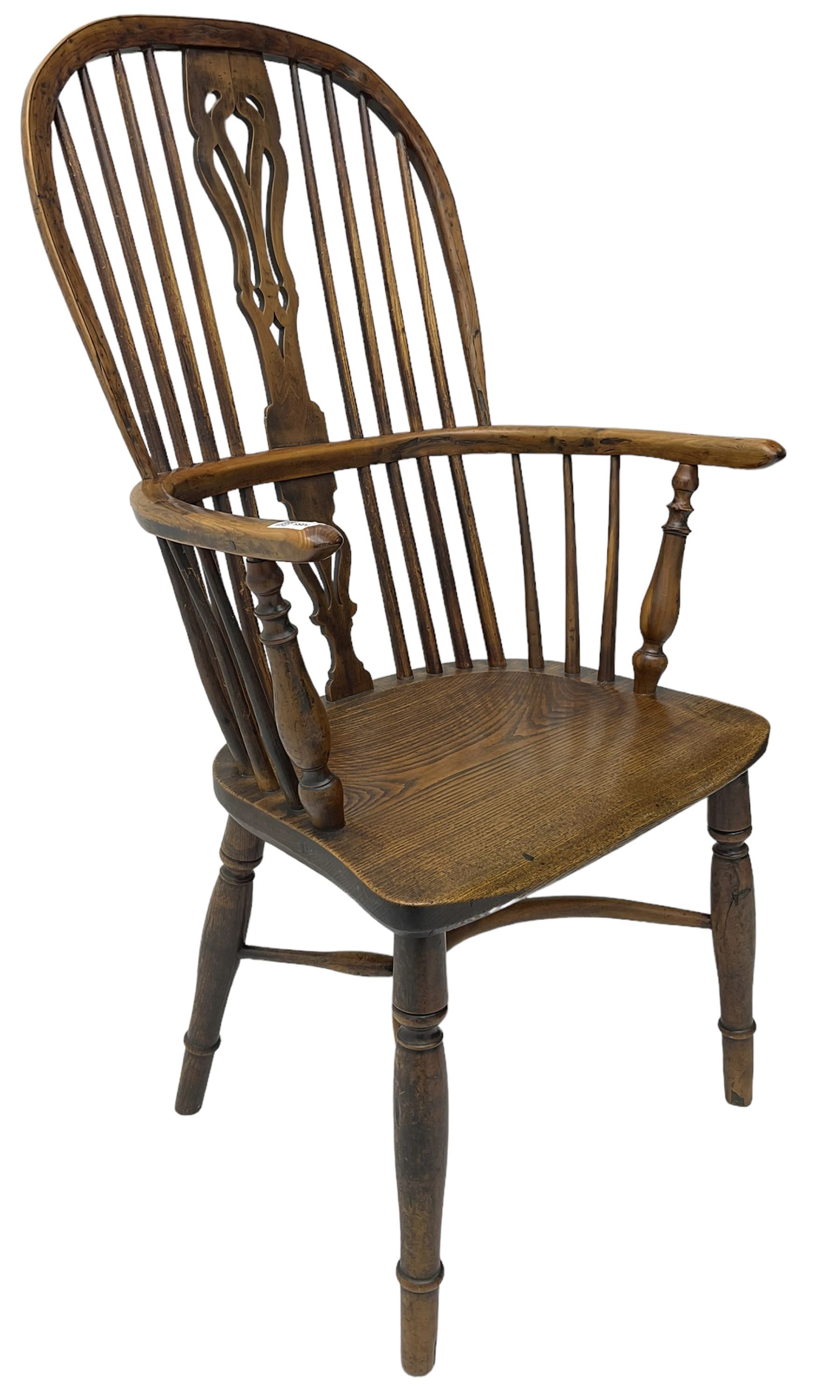 19th century yew wood and elm Windsor chair, high hoop and stick back with pierced splat over dished seat, raised on ring turned supports united by crinoline stretcher