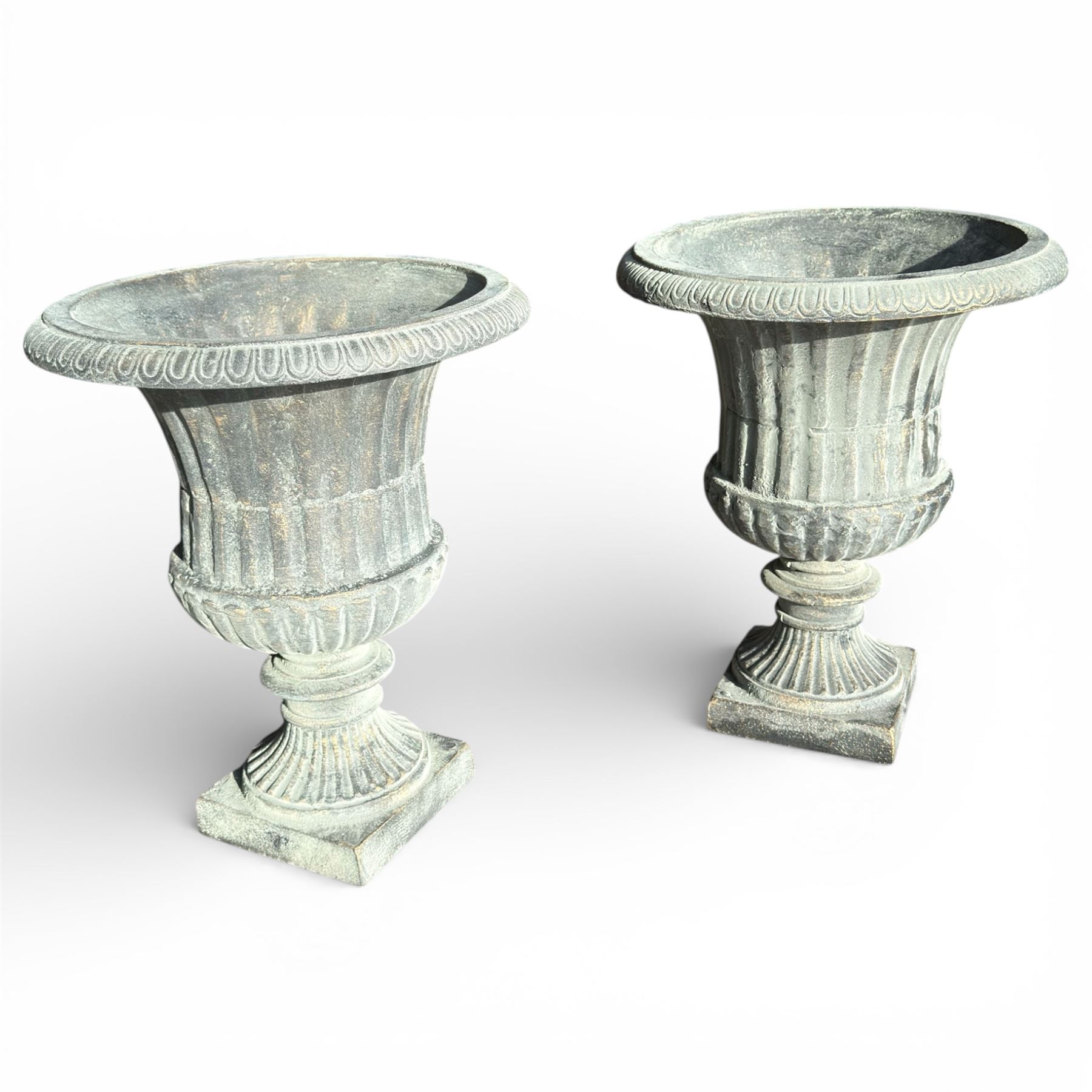 Pair of cast iron Urns on square bases