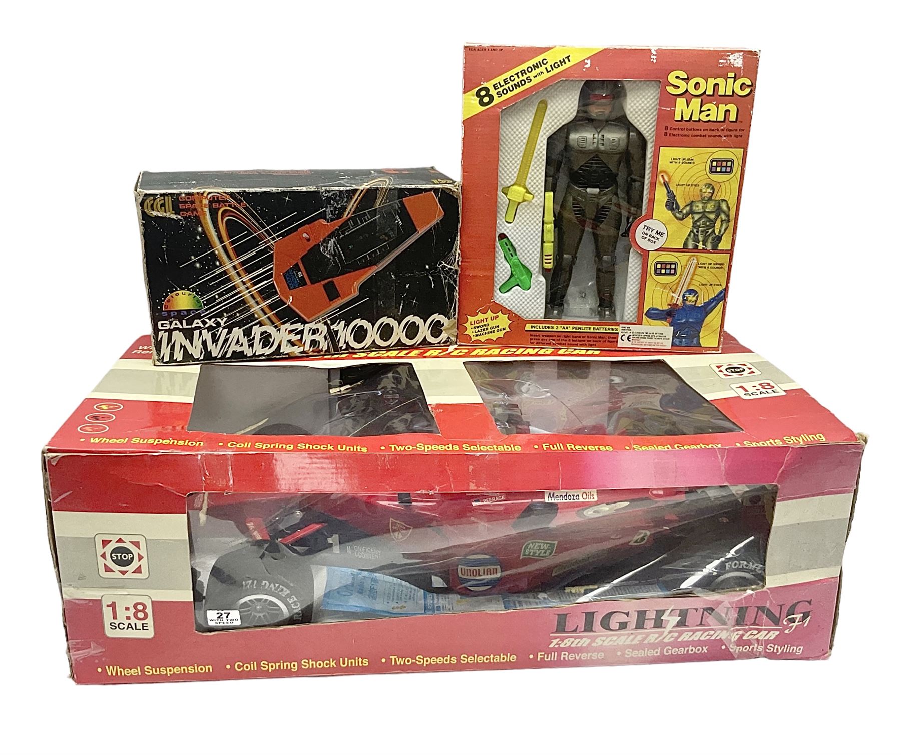 PMS Lightning 1:8 scale remote control racing car; Soma Sonic Man battery operated electronic sounds and light action figure; and CGL Galaxy Invader 10000 computer space battle game; all boxed (3)