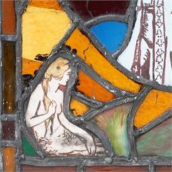 Arts & Crafts leaded stained glass panel depicting a painted seated siren or mermaid and a robed figure 31cm x 28cm