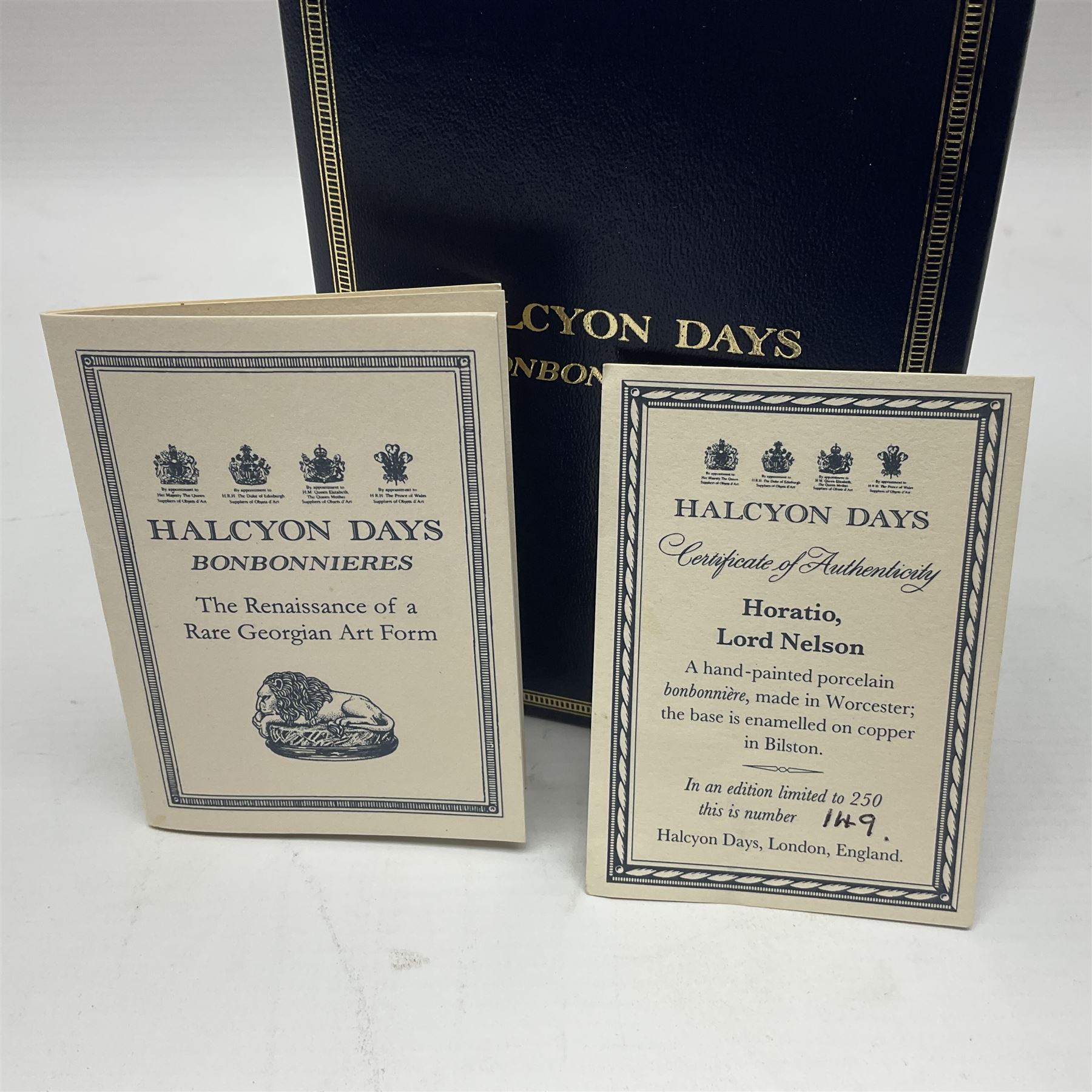 Halcyon Days bonbonniere, modelled as 'Vice-Admiral Lord Nelson', to mark the bicentenary of the British victory at the Battle of Trafalgar, together with another Halcyon Days enamel box depicting Lord Nelson, both boxed 