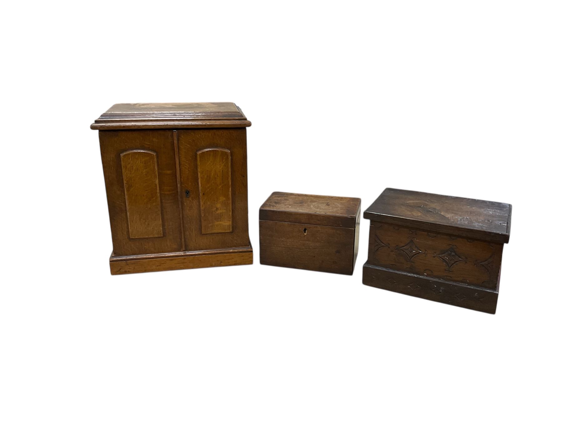 Tabletop chest of drawers, together a wooden tea caddy, and another carved box