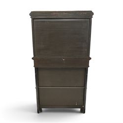Fine late 19th century Aesthetic Movement ebony and amboyna cabinet on stand with parcel-gilt detail, the moulded cornice with pierced gilt-brass three-quarter gallery above a pair of panelled doors centred by oval porcelain portrait plaques within gilt-metal ribbon-tied frames, the doors further enriched with gilt-metal foliate mounts and flanked by classical figural terms, enclosing a shelved interior, the projecting lower section with amboyna top above a frieze drawer set with a series of floral porcelain roundels within pierced gilt-metal mounts and a central oval floral plaque, raised on turned and fluted supports with gilt-heightened detail, the mirrored back behind two amboyna shelves with pierced gilt-brass galleries, on turned feet