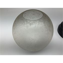 Victorian table standing oil lamp, brass fittings, cranberry glass reservoir, brass column on black enamelled ceramic base, with a frosted glass shade and clear glass chimney, H68cm