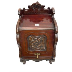 Late 19th century walnut coal box, the shaped pediment carved with c-scrolls and shell, sloped hinged front enclosing metal inset, on foliage carved cabriole feet, with metal carrying handles and coal shovel 