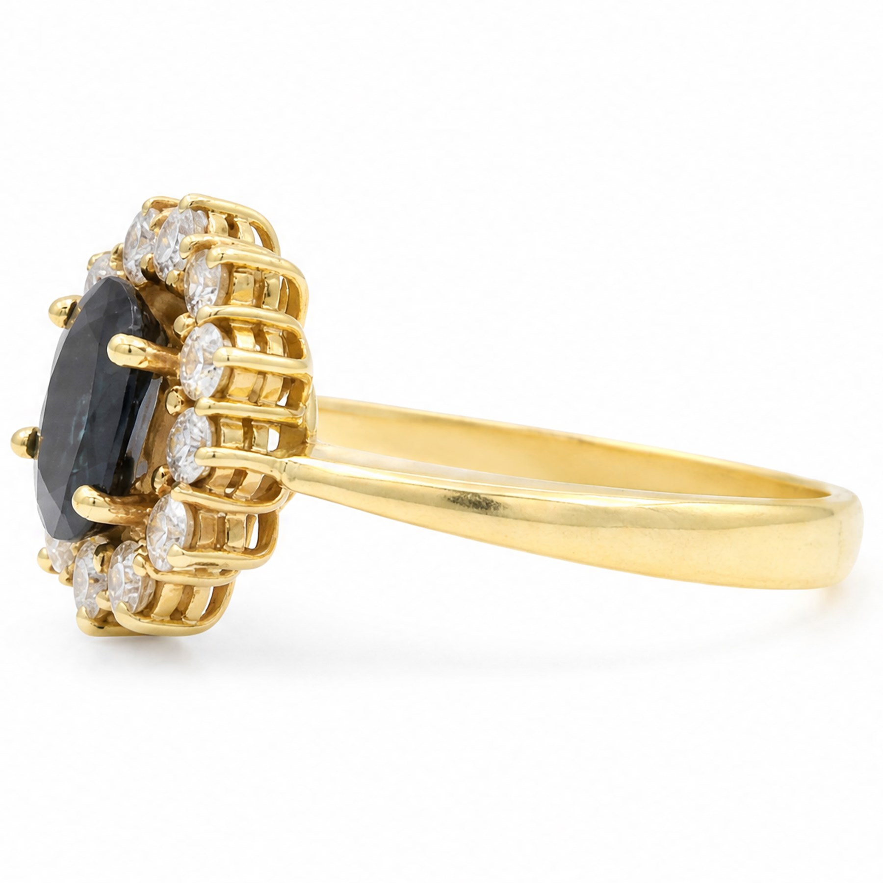 18ct gold sapphire and diamond cluster ring, single oval cut sapphire of approx 1.05 carat, surrounded by twelve round brilliant cut diamonds, stamped 750, total diamond weight approx 0.25 carat