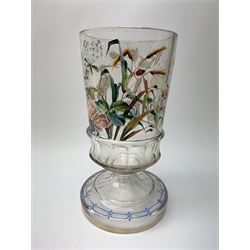 Late 19th century Aesthetic Movement glass vase, the slightly tapering cylindrical clear glass body with faceted lower band, enamelled with a heron and insects amidst blossoming flowers and rushes, upon faceted spreading steam and raised foot with enamelled border, H25.5cm
