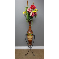  Contemporary terracotta vase with incised floral decoration on wrought metal stand, H125cm of vase and stand  