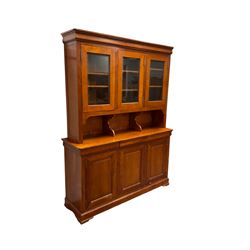 Multi-York -  Loire cherry wood dresser, shaped cornice over three glazed doors enclosing six shelves, the lower section fitted with three shallow drawers with shaped fronts over three cupboards with panelled doors, raised on plinth base with bracket feet