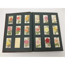 Early 20th century ephemera, to include signed photographs of Charles Boyer and Walter Pidgeon etc, a printed letter from Winston Churchill, two albums and a quantity of transfer books of Players and similar cigarette cards, including Boy Scout and Girl Guide Patrol Signs and Emblems and RAF Badges, a collection of greetings cards and postcards, a photograph album containing black and white photographs of Caius College Cambridge and guides and pamphlets on travelling Switzerland and the UK