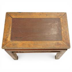 Near pair of 19th century Chinese lacquered elm occasional tables, rectangular top over a bat-motif carved frieze, shaped stretcher rail over tapering supports