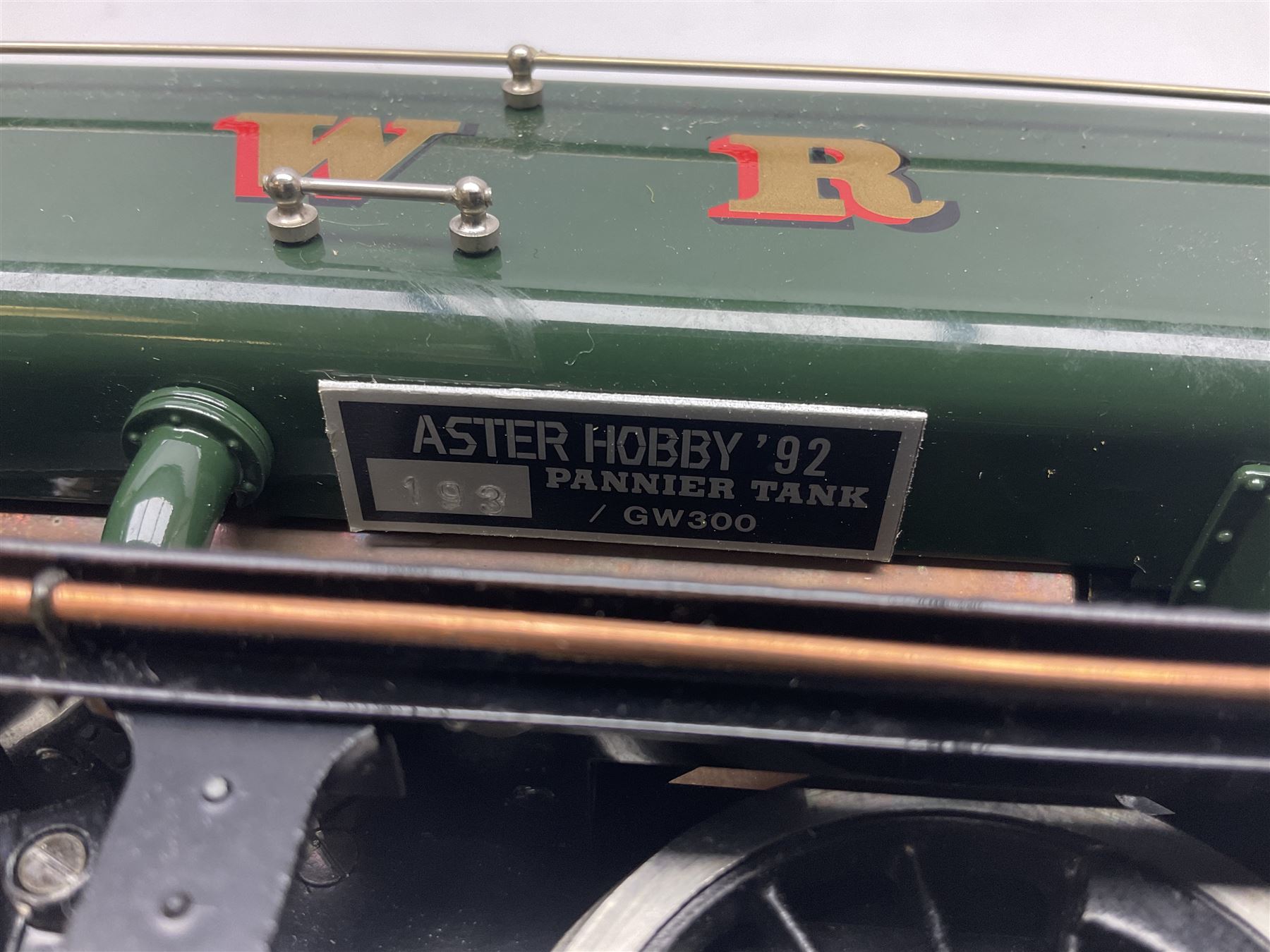 Gauge 1 - Aster 0-6-0 Great Western Railway Pannier tank locomotive No.6752; spirit fired and live steam powered with fitted steam pressure gauge, water sight glass and other usual fittings; finished in Great Western Railway green livery with GWR initials to the pannier tanks, fitted steps, handrails, checker plate, lamp irons, buffers and vacuum hoses; L31cm W8.5cm