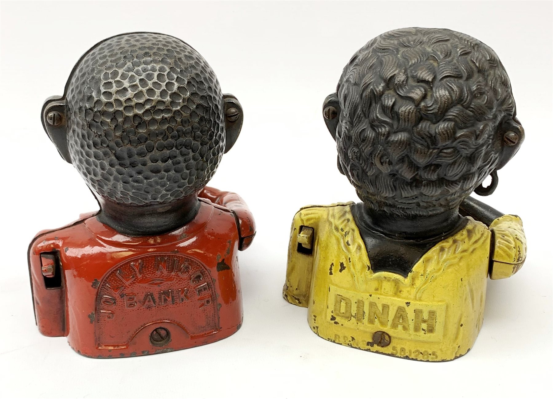 Two 20th century cast iron Jolly money banks, modelled as a male and female figure with mechanical arm, tallest H16cm. 