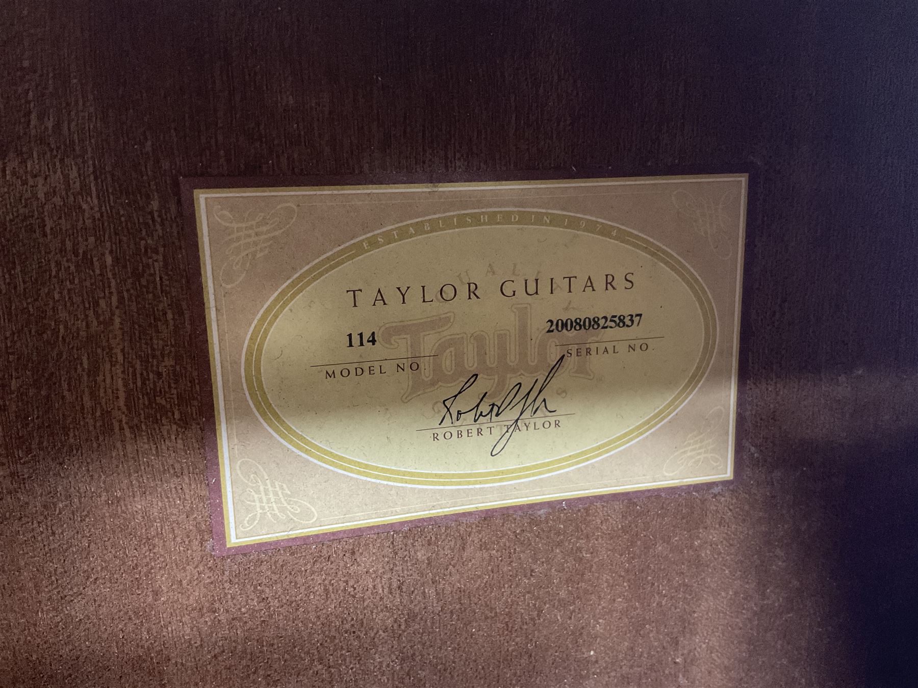 2008 Taylor Model 114 acoustic guitar with mahogany back and ribs and spruce top, serial no.20080825837, L104.5cm; in Taylor hard carrying case with paperwork