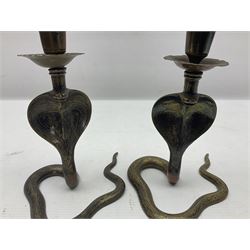 Indian brass pedestal dish, the dish engraved with peacock to centre, the stem modelled as a King Cobra, with engraved and enamelled decoration throughout, together with a similar pair of candlesticks, modelled as King Cobras, dish H23.5cm 