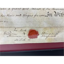 Two mid 18th century indentures of local interest, the first dated 1786 relating to the Garbut family, the second dated 1759, both with wax seals and in glazed frames, W66cm H47cm
