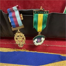 Masonic regalia, including sword, kid leather gloves and apron, Order of Holy Wisdom high priest mitre, etc, contained within briefcases and boxes 