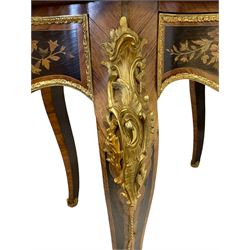 Early 20th century French marquetry inlaid kingwood and ebony centre table, the shaped top inlaid with trailing floral design surrounded by kingwood band with scrolling foliate inlays, the edge with gilt metal mount moulded with scrolled cartouche motifs, fitted with single frieze drawer mounted by female bust and inlaid with extending floral decoration, on cabriole supports with scrolled foliate cartouche mounts 