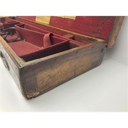 Leather shotgun case, the red baize lined interior with the trade labels of Westley Richards & Co., London, a brass plaque inscribed 'T Nevin, Mirfield, Yorkshire' to cover, with key, case to fit barrel 76cm (30 inches)  
