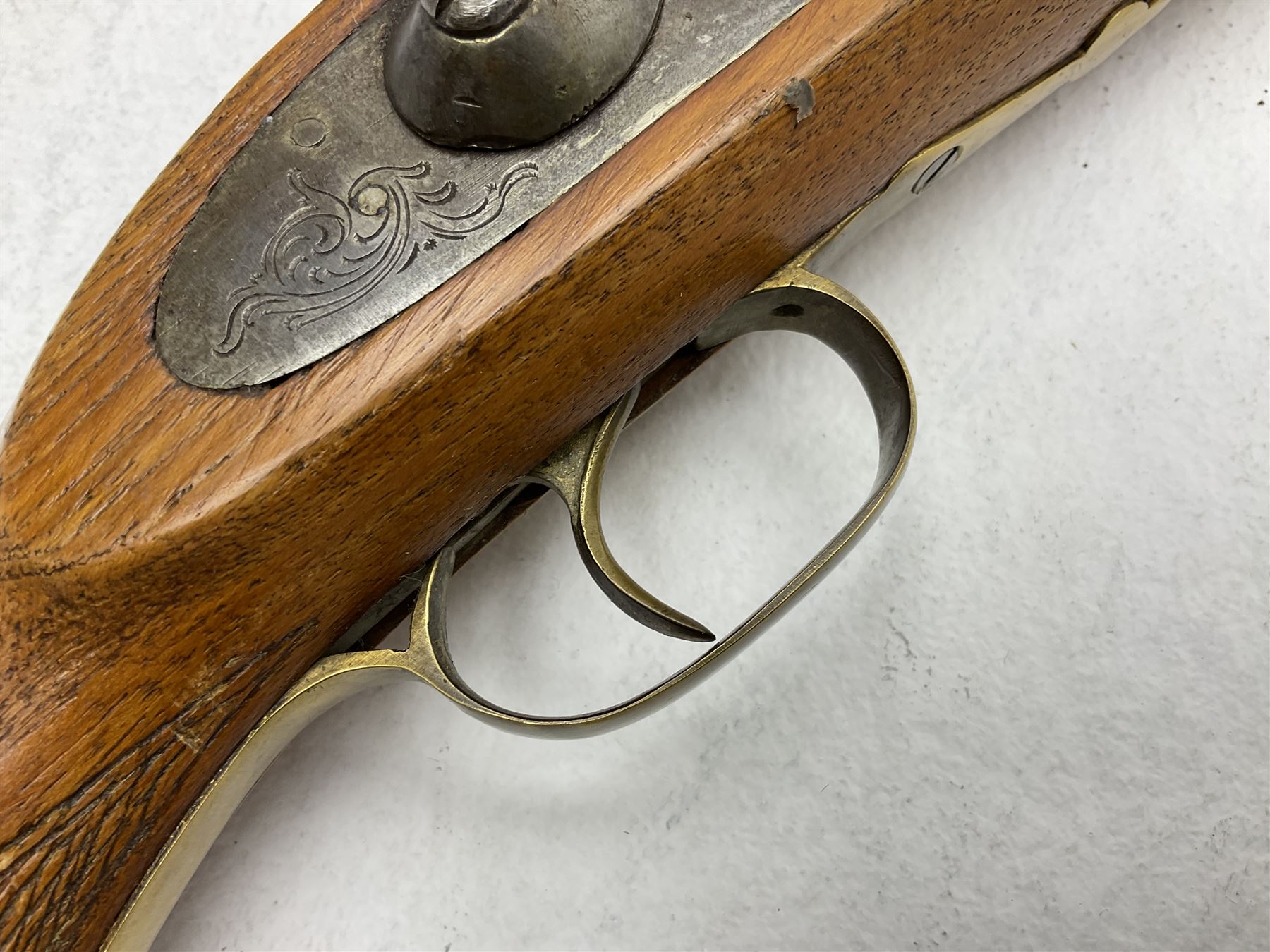 20th century Indian percussion musket, the 81cm octagonal barrel with under rib and ramrod, brass fittings including front and rear swivels, oak half stock with cheek piece and chequered pistol grip stamped 1589 L124.5cm overall