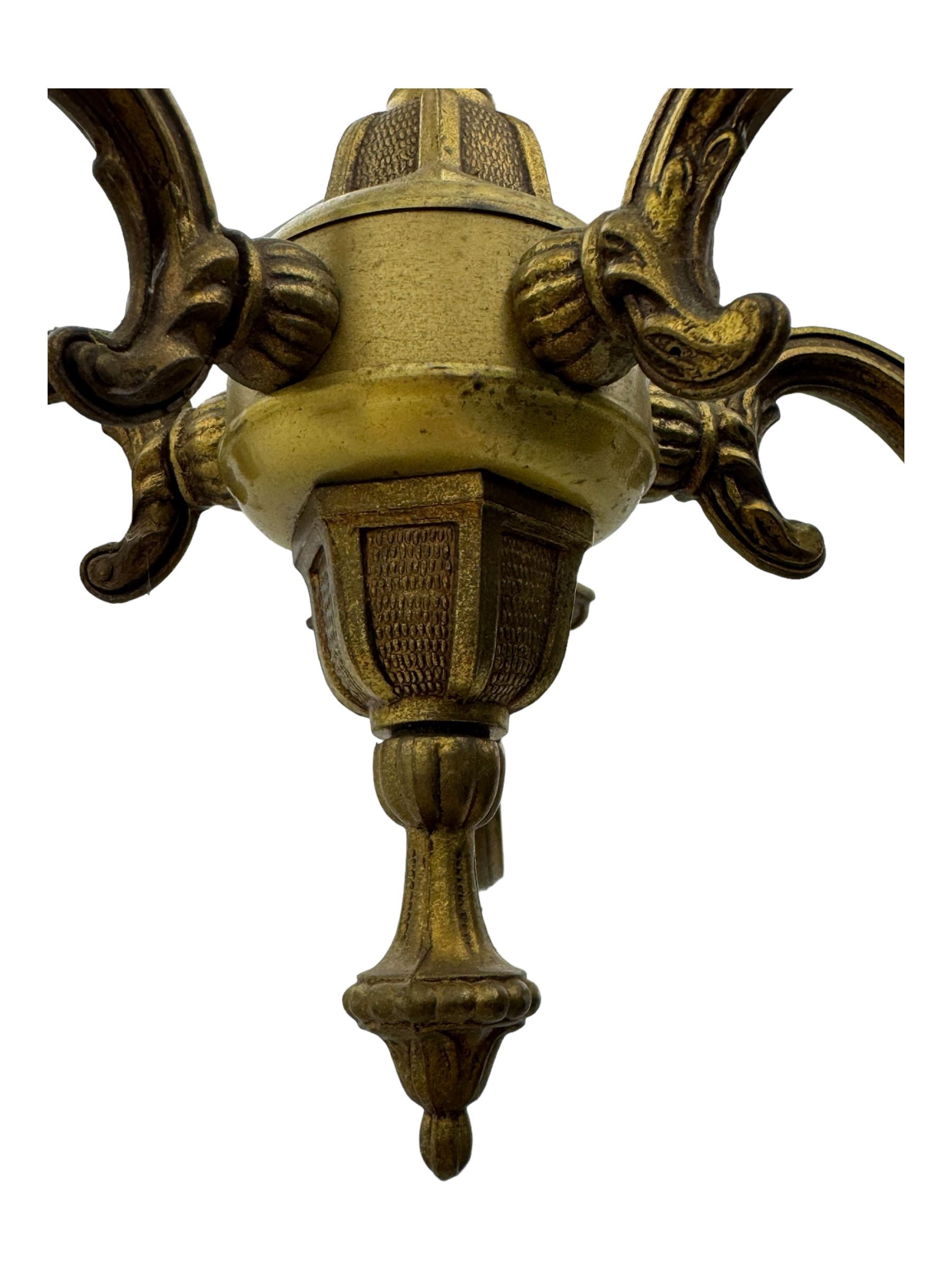 Collection of vintage and modern light fixtures, including copper pendant light, brass five-arm chandelier, hanging lantern and two small chandeliers with hanging faceted droplets (6)