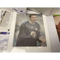 Collection of approximately 200 Leeds United related autographs, predominantly signed newspaper cuttings, contained within ring binder, together with a number of loose examples