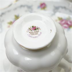 Royal Albert Lavender Rose tea and dinner wares, comprising eight dinner plates, and eight small dinner plates, eight side plates, open serving dish, teapot, open sucrier, salt and pepper, sandwich plate, sauce boat and saucer, eight teacups and saucers, six bowls, six oval serving dishes, and one platter